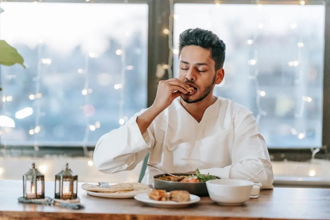 Man enjoying candlelit dinner